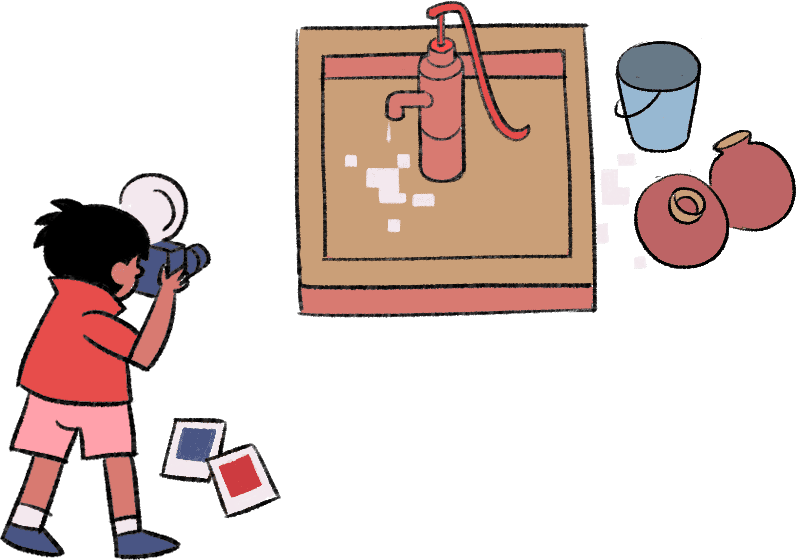 A boy is holding a camera to his eyes, taking pictures of a broken water pump in front of him.